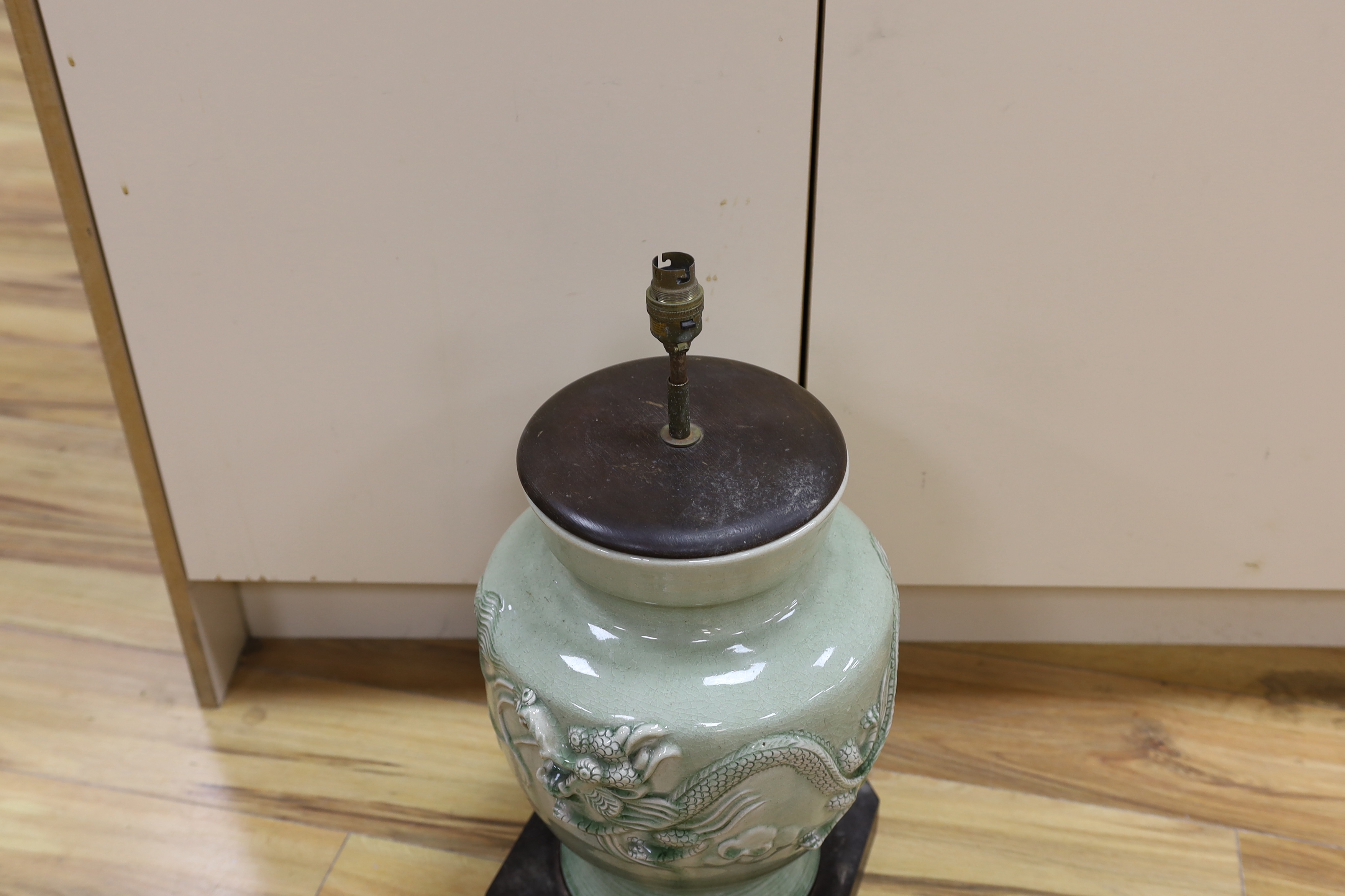 A Chinese celadon glazed lamp, 55cm high